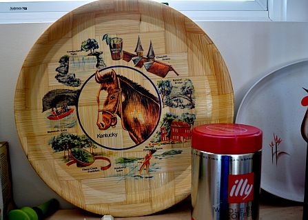 Vintage tray with horse in the middle.