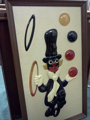 Picture of a clown in black face juggling found in an antique store.